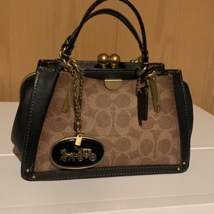 Coach purse 25% off any dress with purchase